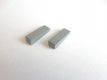 Klínový pryžový doraz šedý; 20x6x3/5 mm; hm. 1g; ; Výrobce: Teguza (technická guma, pryž, prodej a výroba na zakázku)